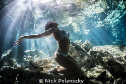 Freediver Model Natalia embracing the sunlight beaming th... by Nick Polanszky 